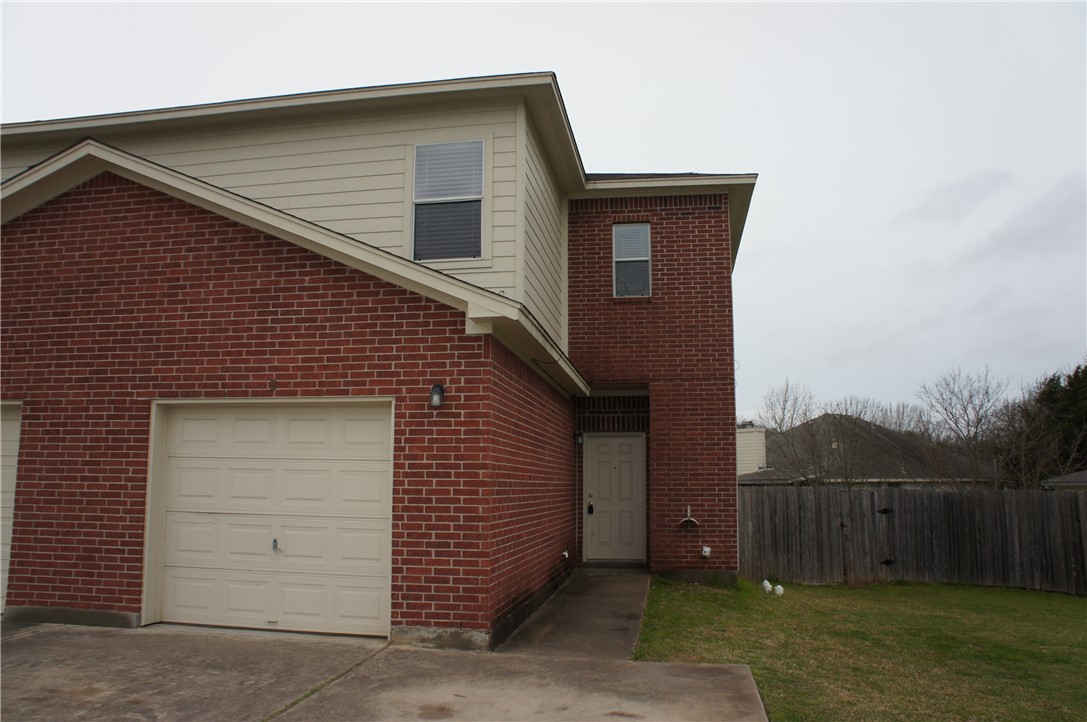 503 Luther Drive, Unit B Georgetown, TX 78628 - Photo 1 of 1 a front view of a house with a garage
