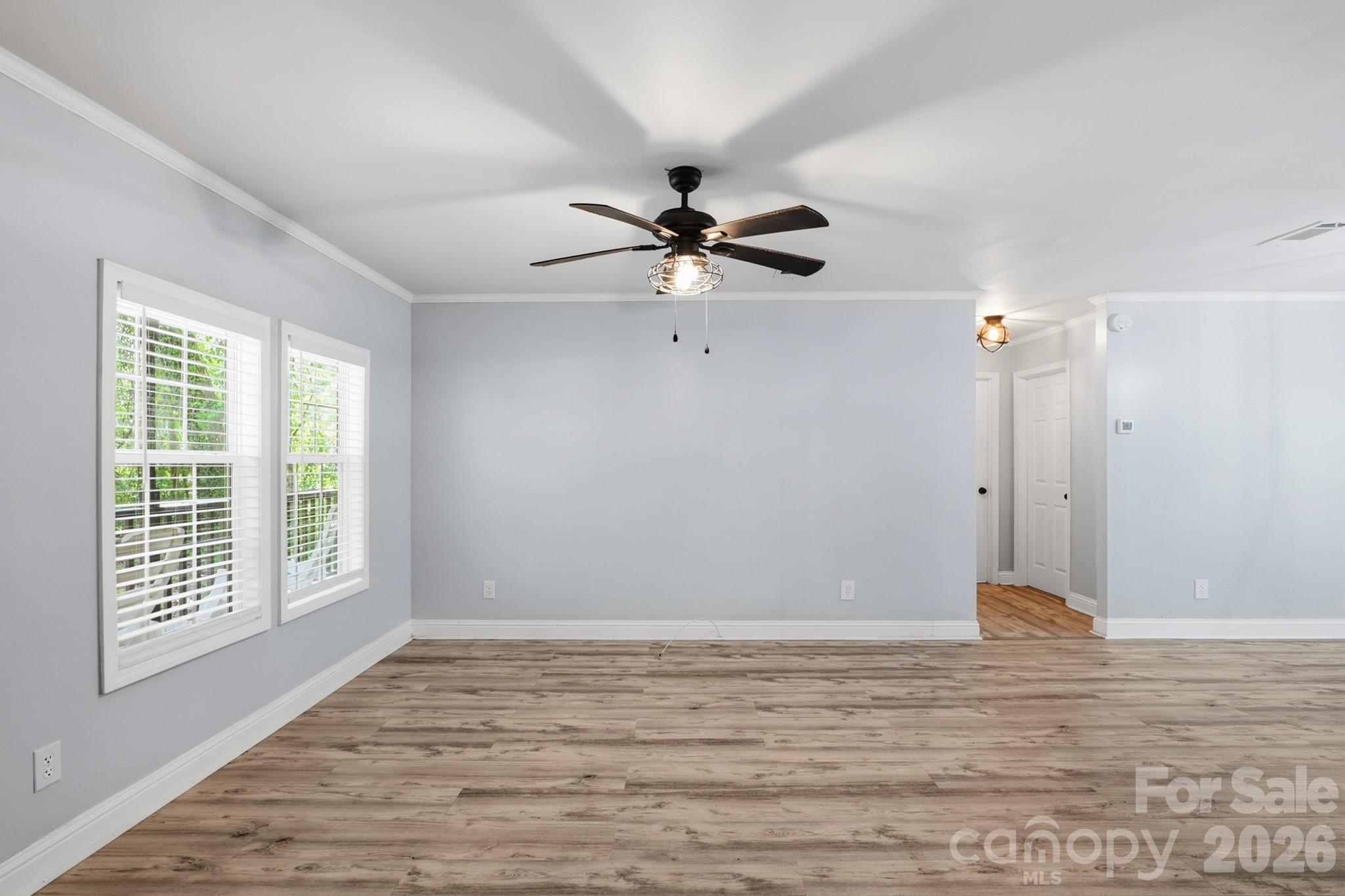 116 Springdale Drive York, SC 29745 - Photo 13 of 32 a view of an empty room with window and a ceiling fan