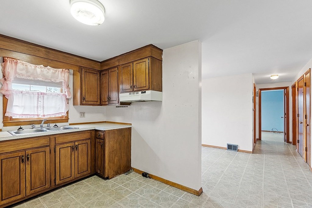 49 State Road West Westminster, MA 01473 - Photo 8 of 34 a kitchen with a sink stove and cabinets