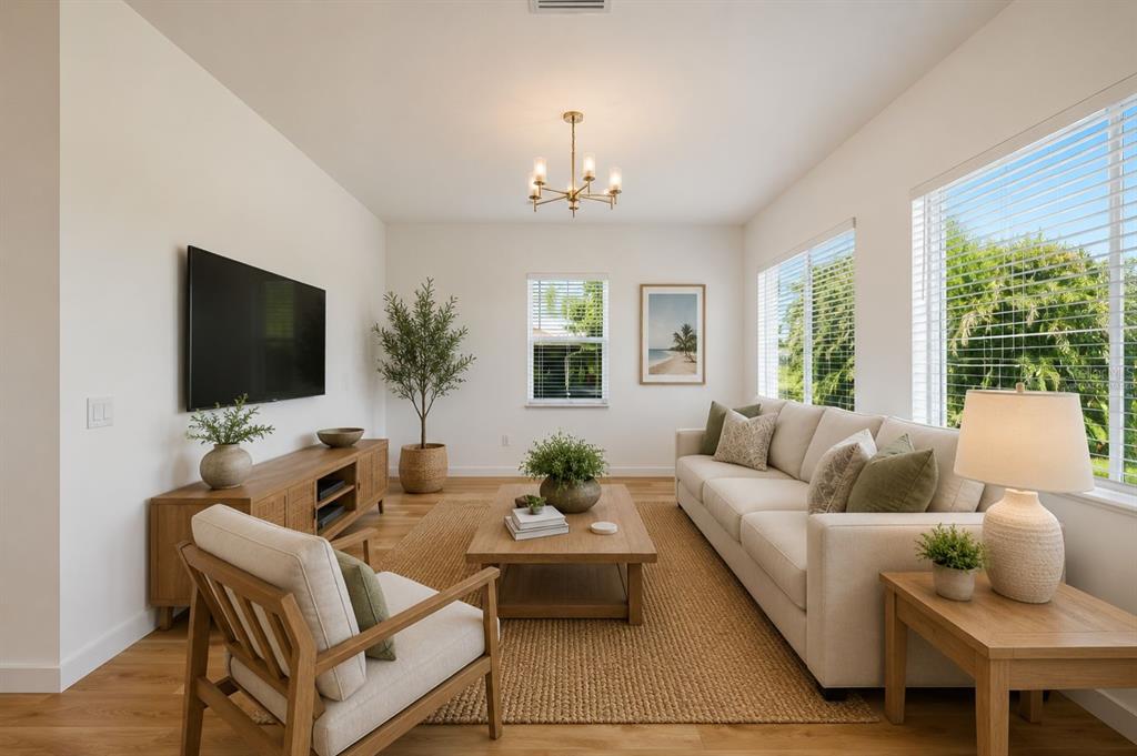 1215 Rio De Janeiro Avenue Punta Gorda, FL 33983 - Photo 6 of 65 a living room with furniture fireplace and a flat screen tv
