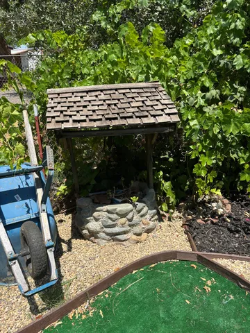 a view of a backyard with sitting area