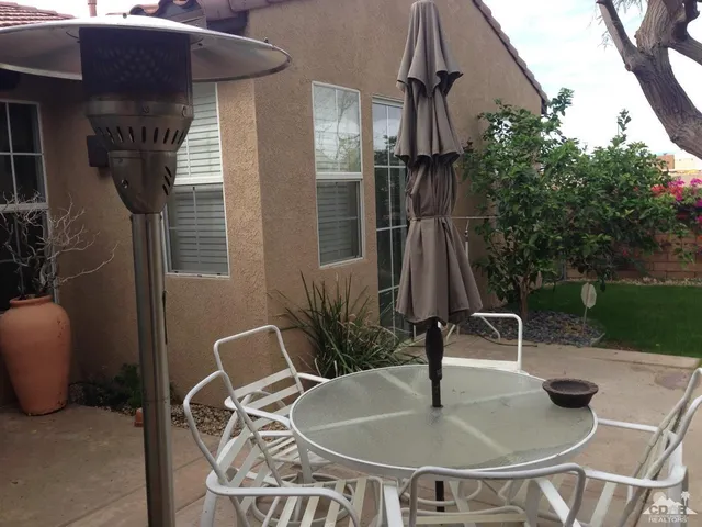 a table and chairs in a patio
