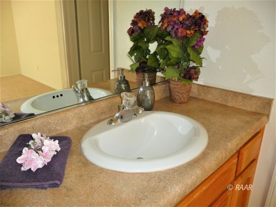 1129 Porter Street Ridgecrest, CA 93555 - Photo 14 of 22 a bathroom with a double vanity sink
