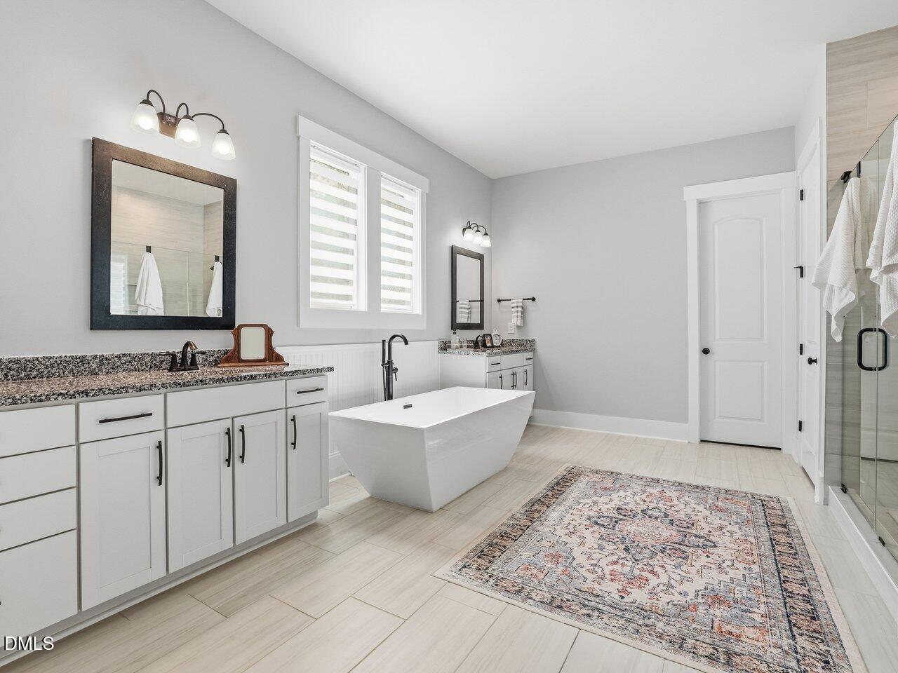 36 Nuthatch Pittsboro, NC 27312 - Photo 27 of 66 a spacious bathroom with sinks mirror and a bathtub