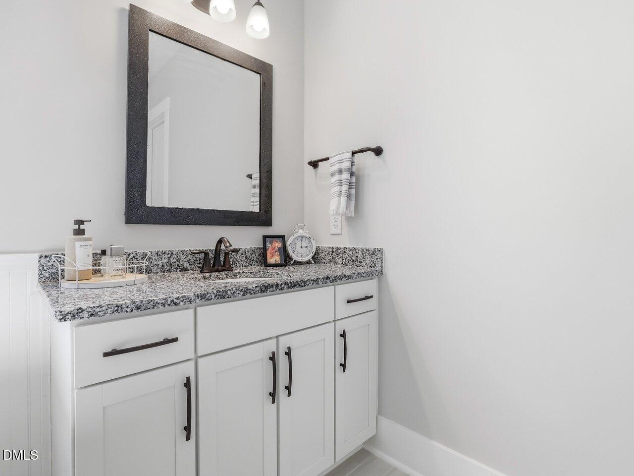 36 Nuthatch Pittsboro, NC 27312 - Photo 29 of 66 a bathroom with a granite countertop sink vanity and mirror