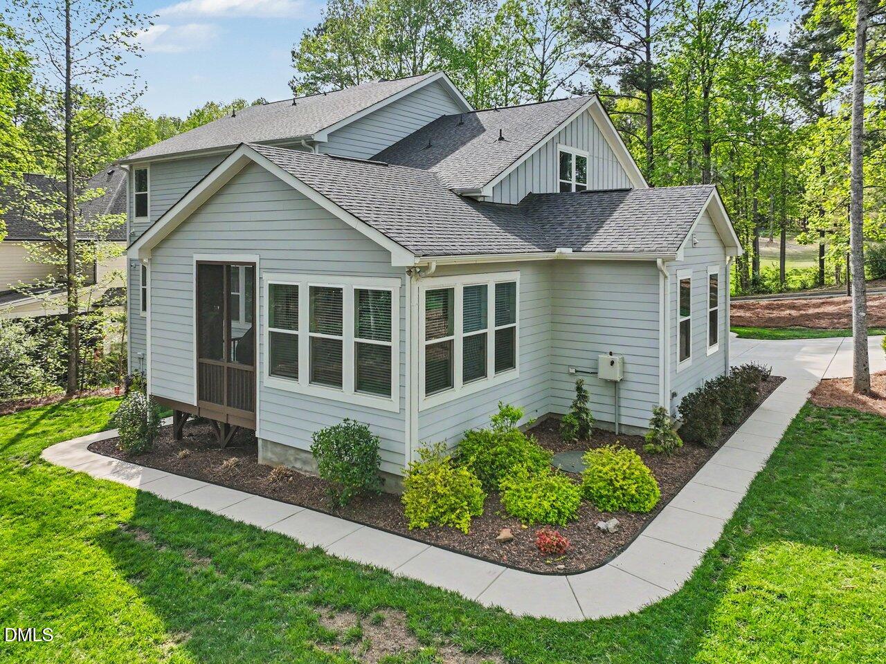 36 Nuthatch Pittsboro, NC 27312 - Photo 3 of 66 a view of a house with a yard and potted plants