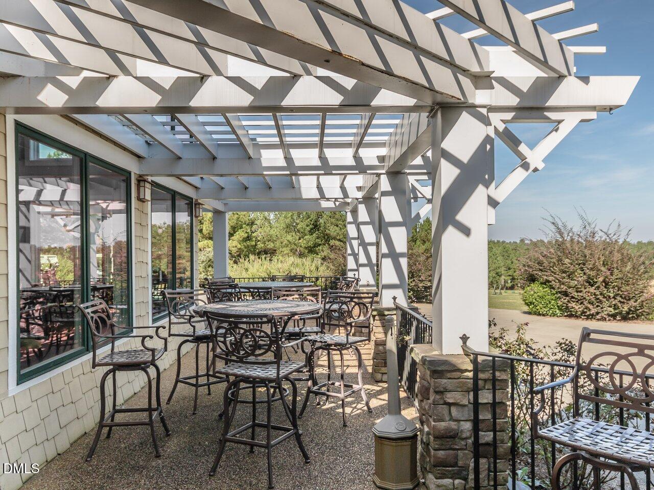 36 Nuthatch Pittsboro, NC 27312 - Photo 64 of 66 a view of a patio with table and chairs and potted plants