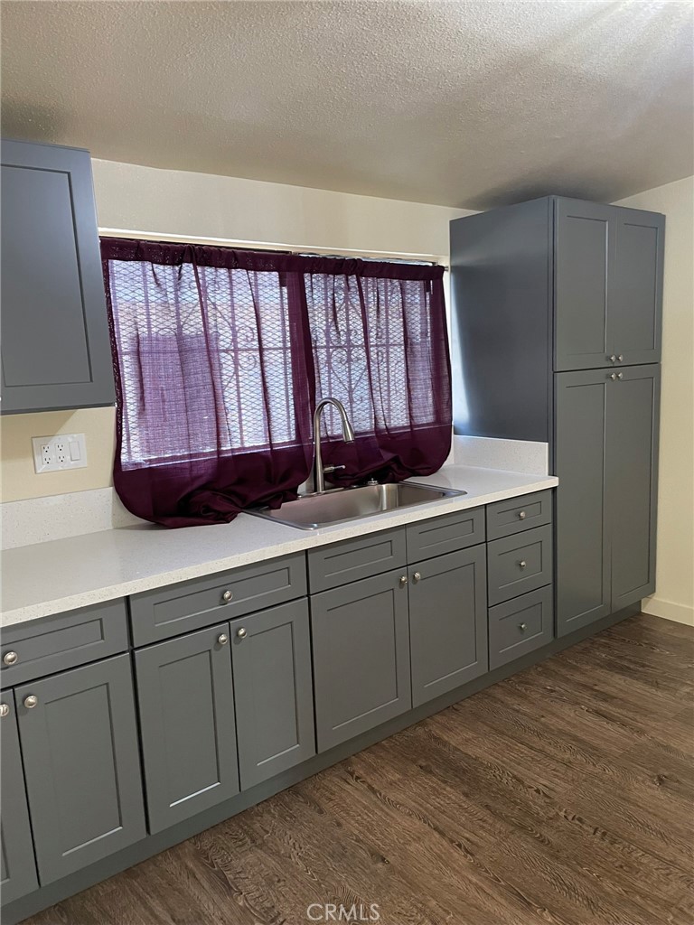 4122 Whittier Boulevard Los Angeles, CA 90023 - Photo 1 of 18 a kitchen with a sink window and cabinets