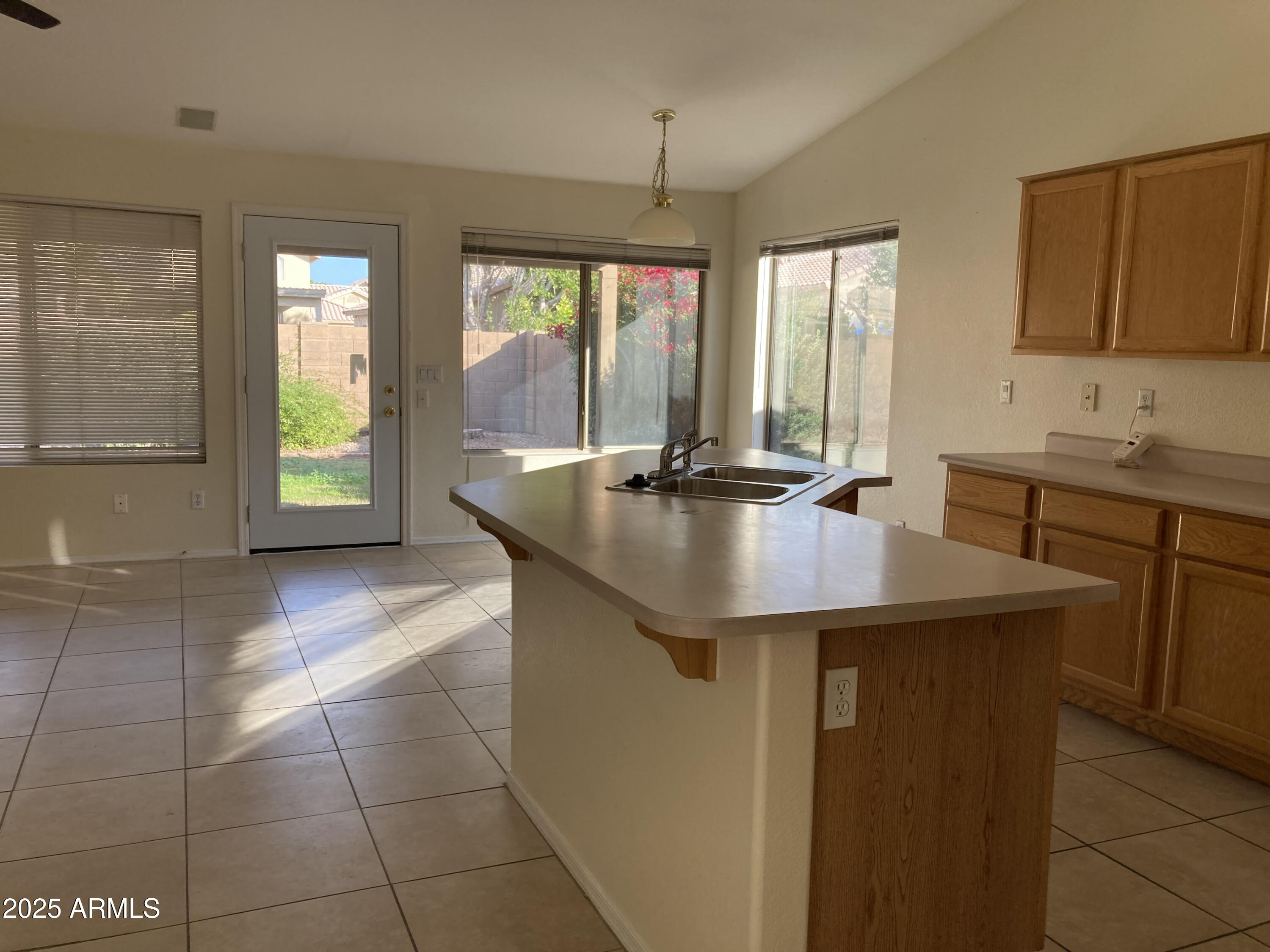 436 West Bolero Drive Tempe, AZ 85284 - Photo 2 of 11 a kitchen with a sink a counter top space and living room