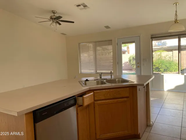a kitchen with a sink and a window