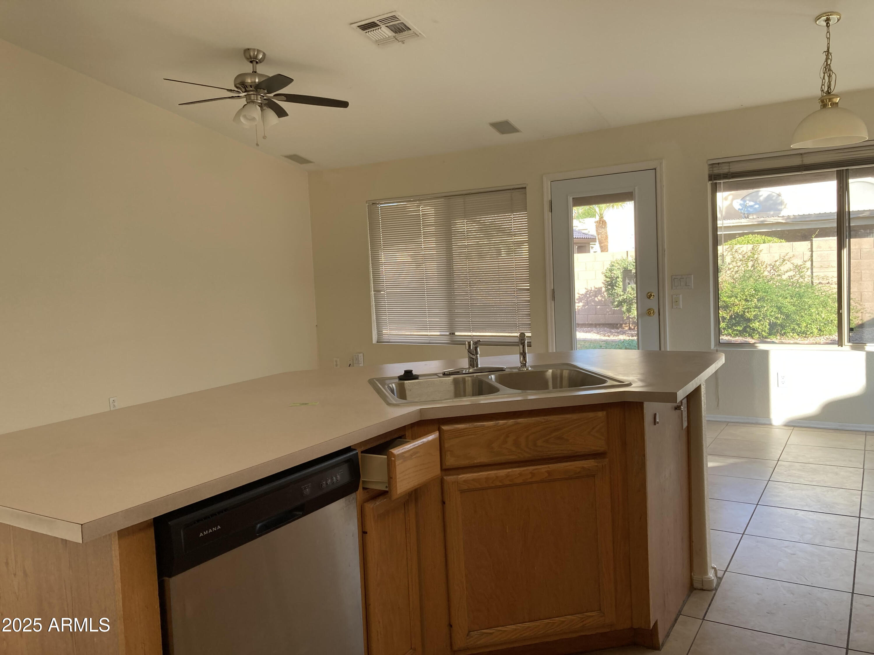 436 West Bolero Drive Tempe, AZ 85284 - Photo 3 of 11 a kitchen with a sink and a window