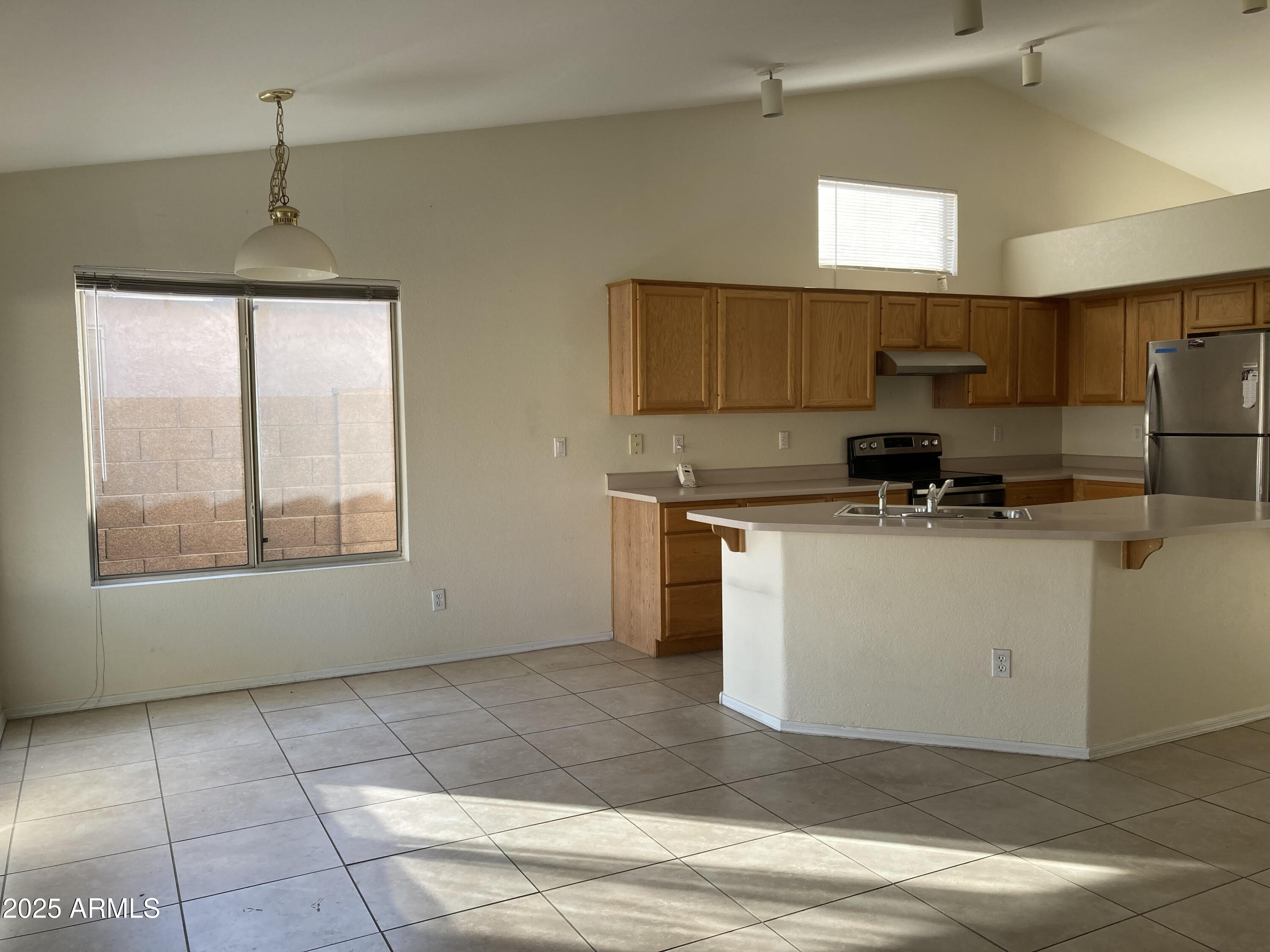 436 West Bolero Drive Tempe, AZ 85284 - Photo 4 of 11 a kitchen with stainless steel appliances granite countertop a stove a sink and a microwave