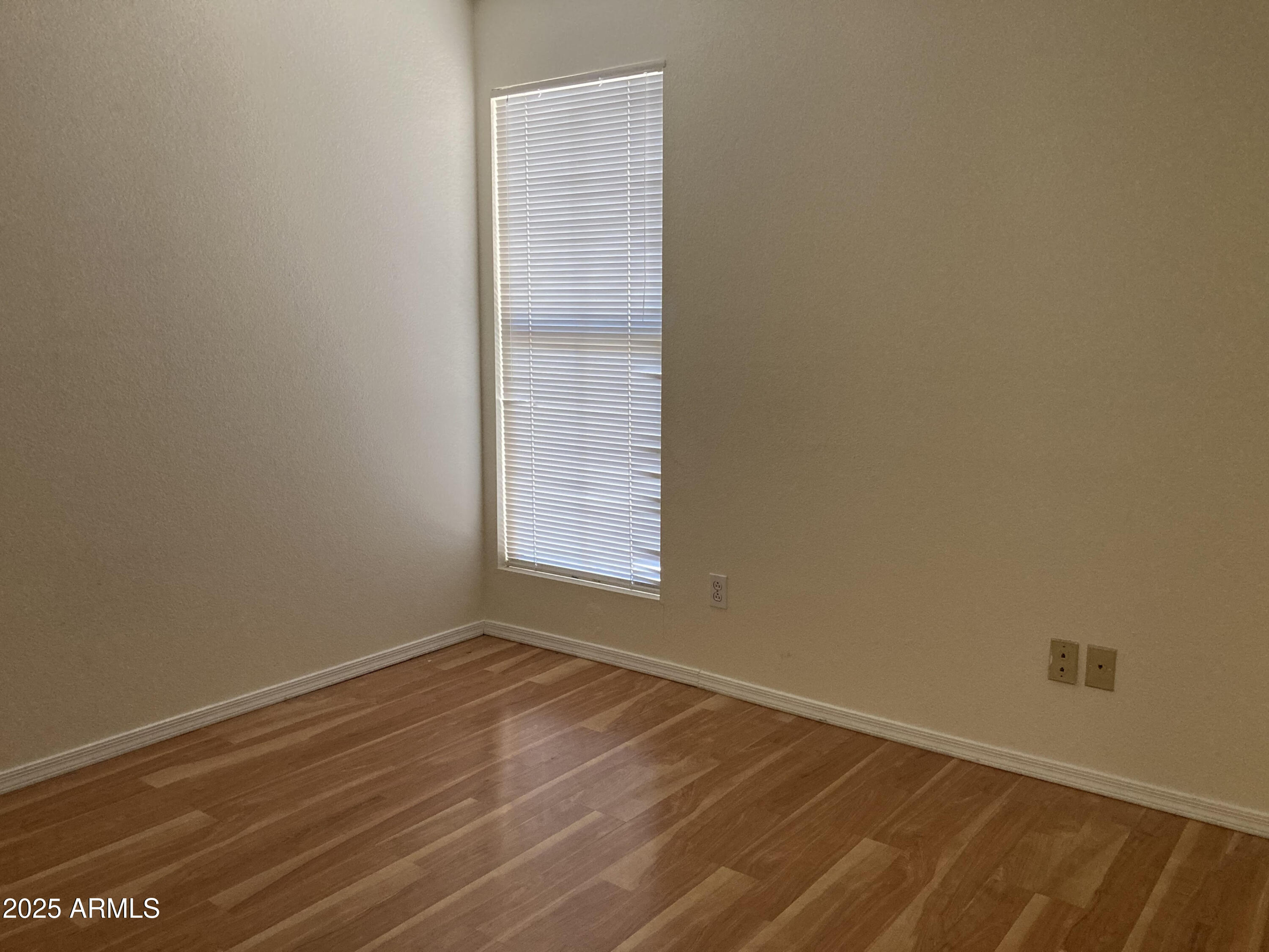 436 West Bolero Drive Tempe, AZ 85284 - Photo 7 of 11 an empty room with wooden floor and windows