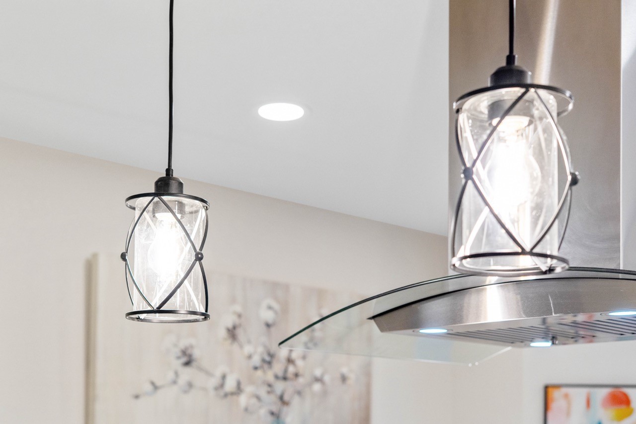 3138 Sunbeam Street Houston, TX 77051 - Photo 17 of 50 Modern designer lighting adds a sophisticated glow, elevating the kitchen with upscale character and contemporary charm.
