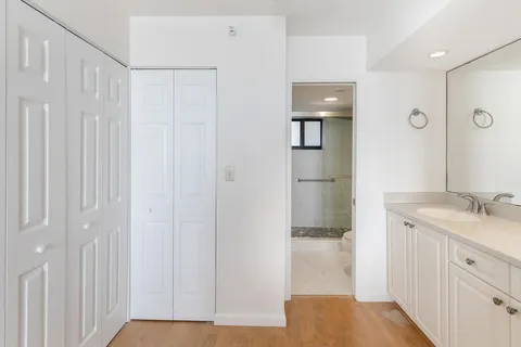 a bathroom with a sink and shower