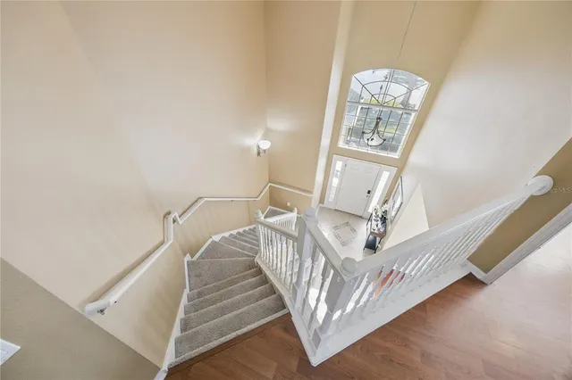 a spacious bedroom with a bed a couch and window