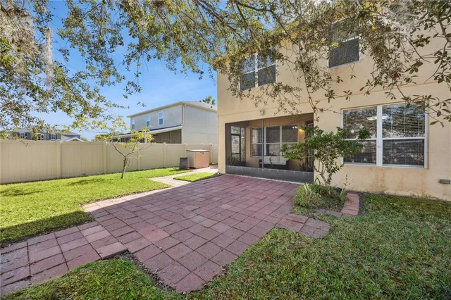 an aerial view of residential houses with outdoor space and swimming pool