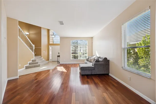 a living room with furniture and a large window