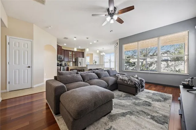a living room with furniture and a large window