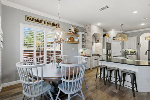 464 Monahans Drive Georgetown, TX 78628 - Photo 12 of 39 a view of a dining room with furniture window and wooden floor