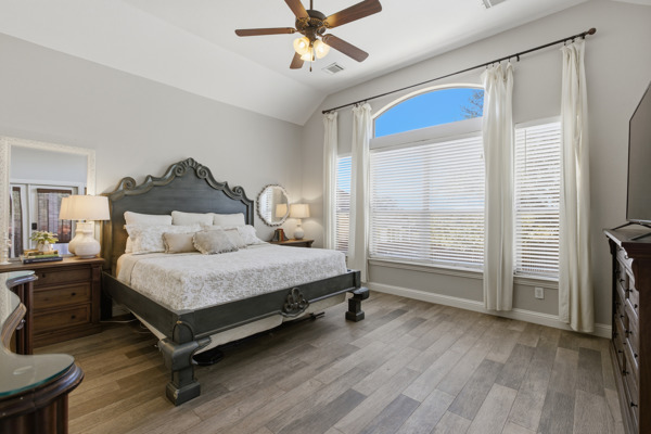 464 Monahans Drive Georgetown, TX 78628 - Photo 18 of 39 a bedroom with a bed and a ceiling fan