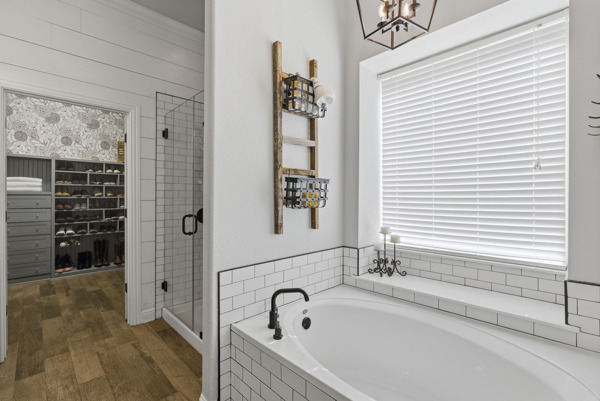 464 Monahans Drive Georgetown, TX 78628 - Photo 20 of 39 a bathroom with a bathtub and a shower