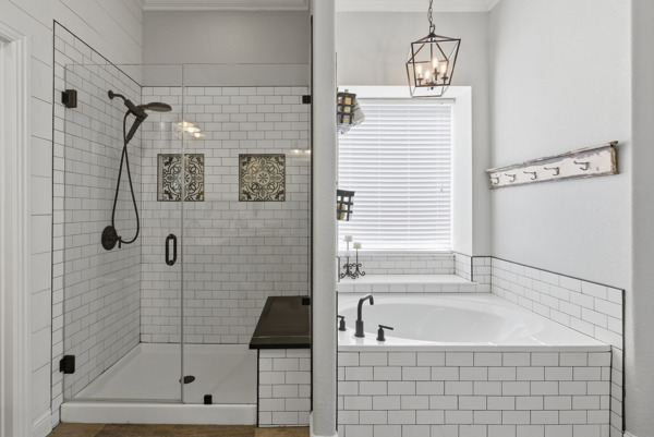 464 Monahans Drive Georgetown, TX 78628 - Photo 22 of 39 a bathroom with a shower and a bathtub