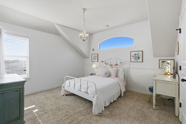 464 Monahans Drive Georgetown, TX 78628 - Photo 28 of 39 a bedroom with a bed and a table in it