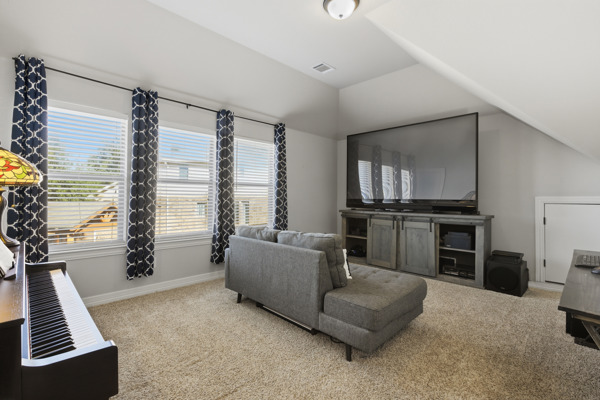 464 Monahans Drive Georgetown, TX 78628 - Photo 30 of 39 a living room with furniture and a flat screen tv