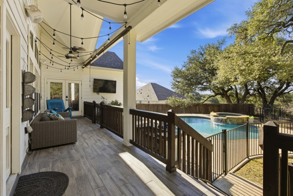 464 Monahans Drive Georgetown, TX 78628 - Photo 32 of 39 a view of a porch with couches chairs and wooden floor