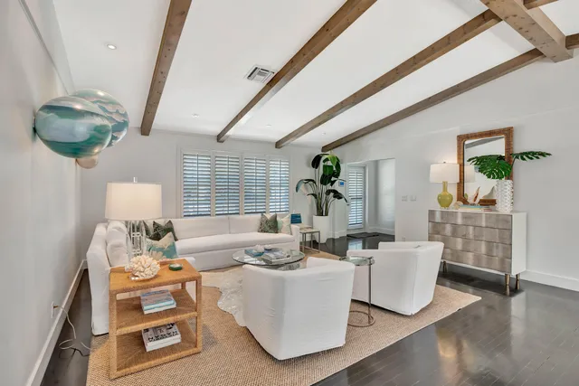 a kitchen with stainless steel appliances granite countertop a stove and white cabinets