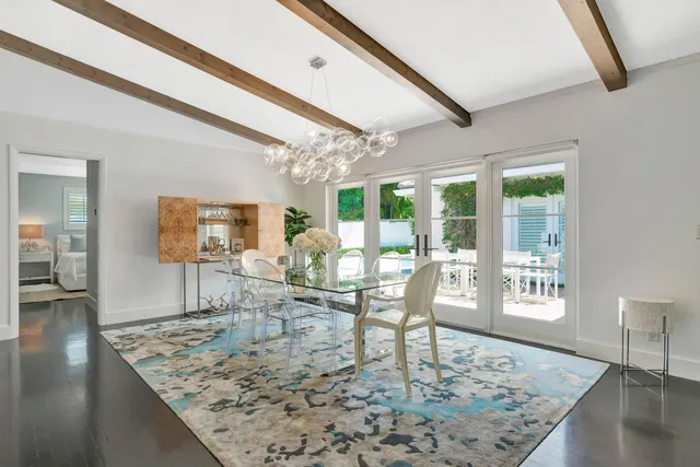 a kitchen with white cabinets and appliances