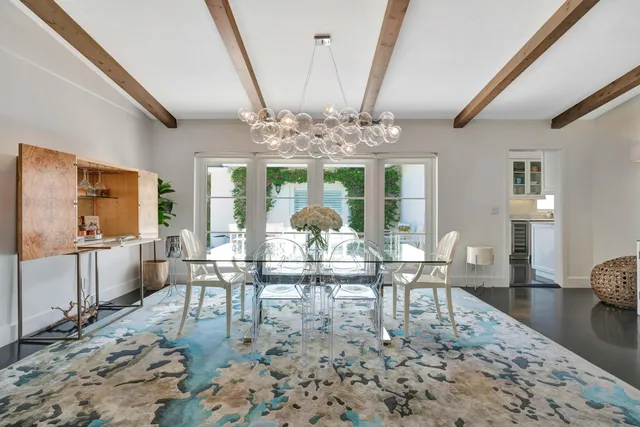 a kitchen with stainless steel appliances granite countertop a sink and cabinets with wooden floor