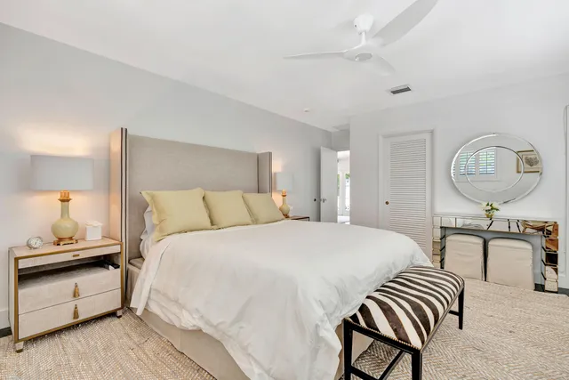 a living room with furniture and a lamp