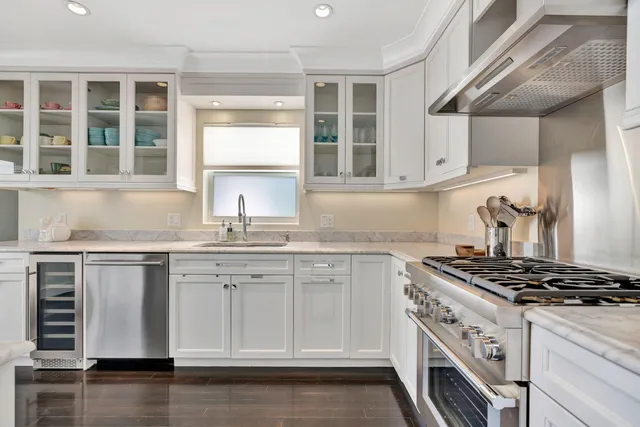 a bedroom with a bed window and a night stand