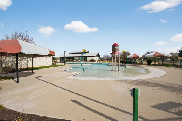 a swimming pool with view of the house