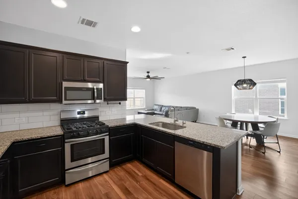 a kitchen with a stove and a sink