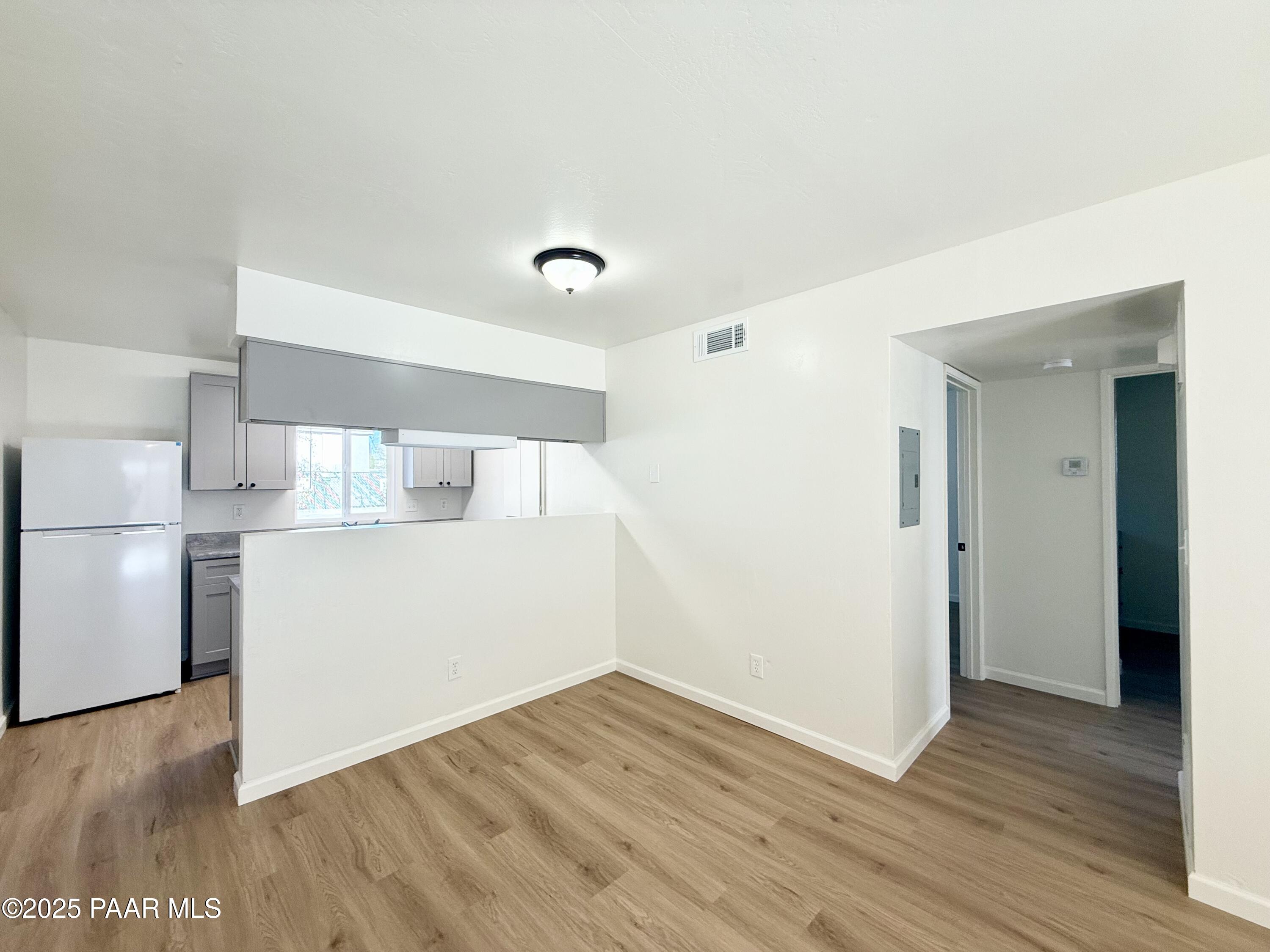 564 Lincoln Avenue, Unit B Prescott, AZ 86301 - Photo 2 of 11 a view of a kitchen with wooden floor