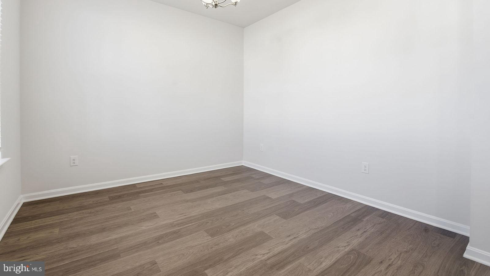 8110 Cypress Pt Drive Rosedale, MD 21237 - Photo 10 of 37 a view of an empty room with wooden floor
