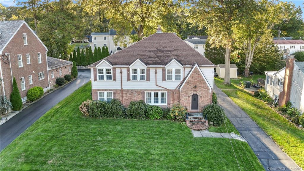 435 Ridge Road Wethersfield, CT 06109 - Photo 1 of 1 a front view of a house with a yard