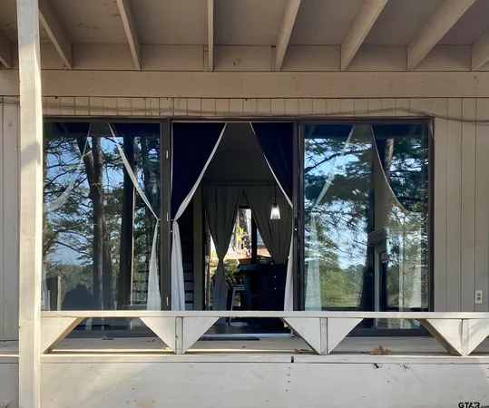 a view of building with glass door and door