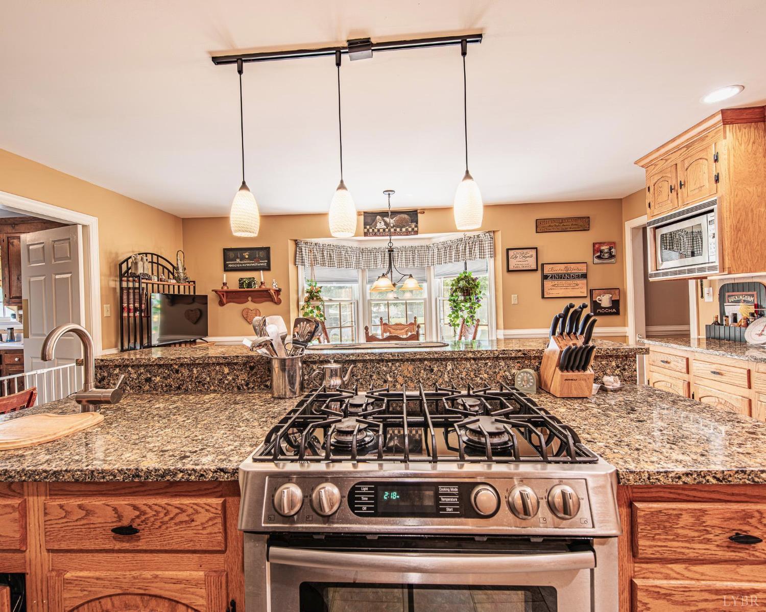 2667 Union Church Road Gladstone, VA 24553 - Photo 17 of 75 a kitchen with granite countertop a stove and a sink