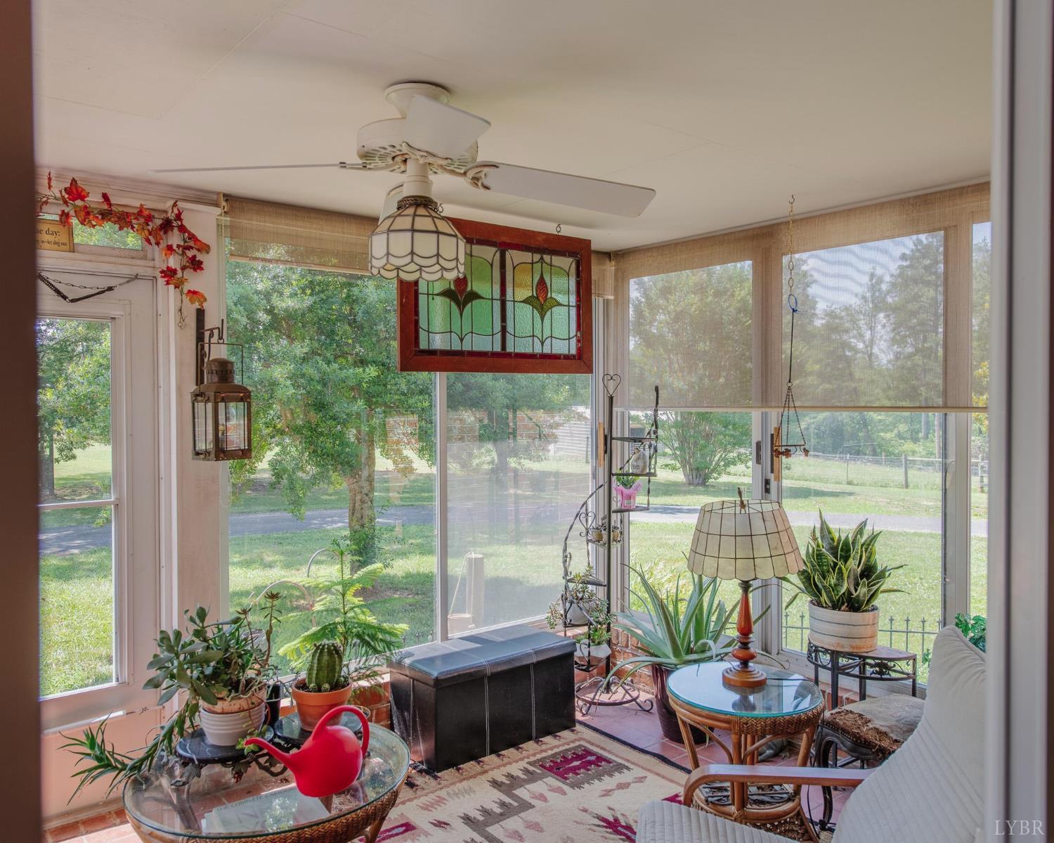 2667 Union Church Road Gladstone, VA 24553 - Photo 27 of 75 a living room with patio furniture and a potted plant