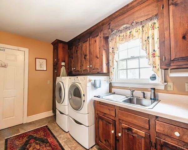 a view of a house with backyard sitting area and garden