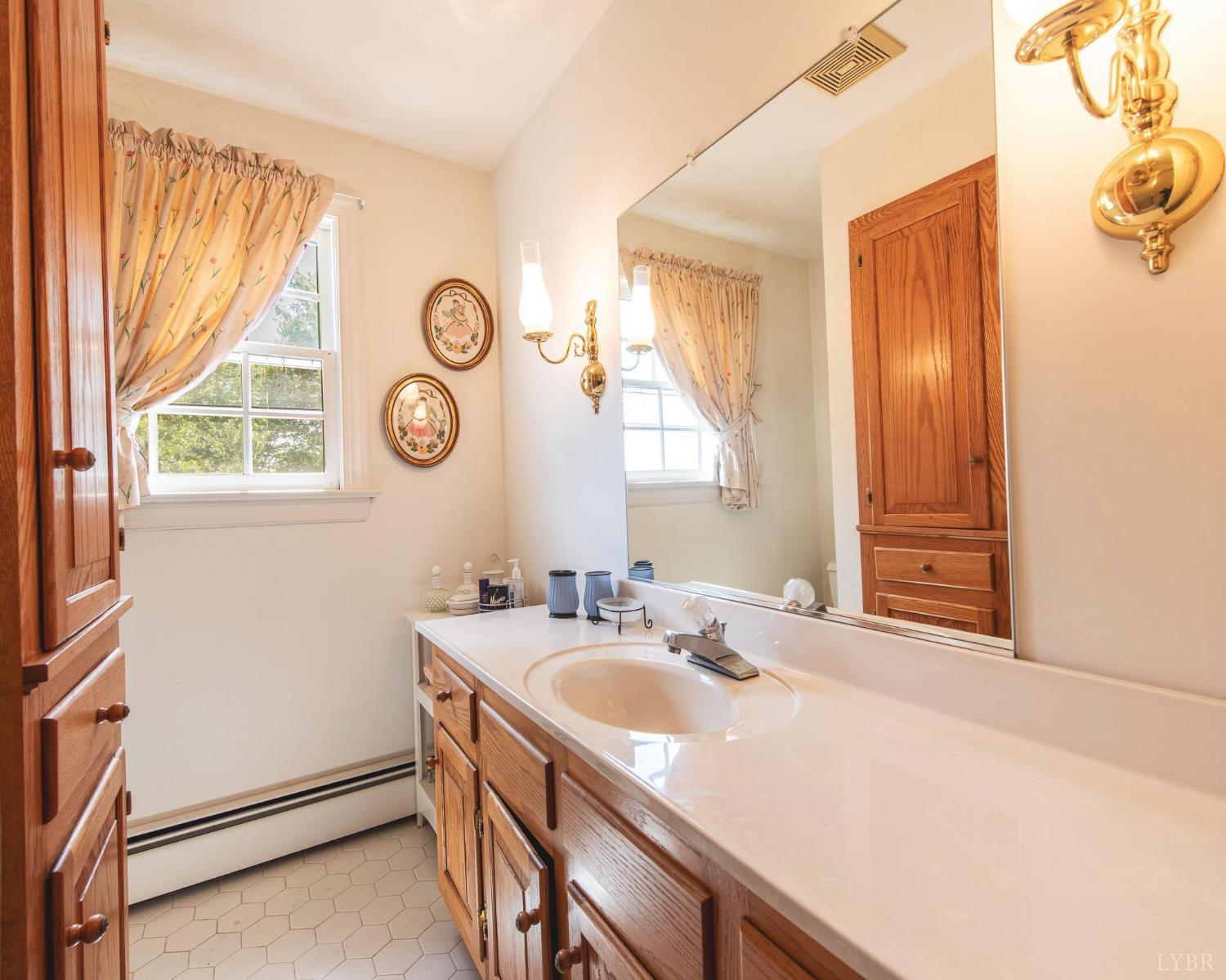 2667 Union Church Road Gladstone, VA 24553 - Photo 41 of 75 a bathroom with a sink and a mirror