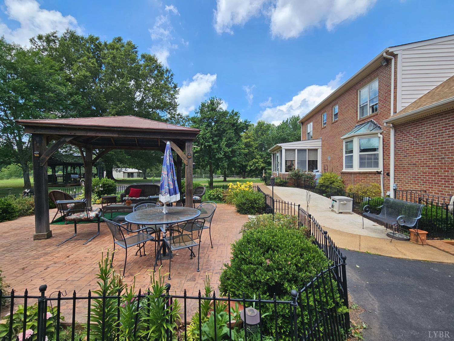 2667 Union Church Road Gladstone, VA 24553 - Photo 47 of 75 a view of a house with backyard sitting area and garden