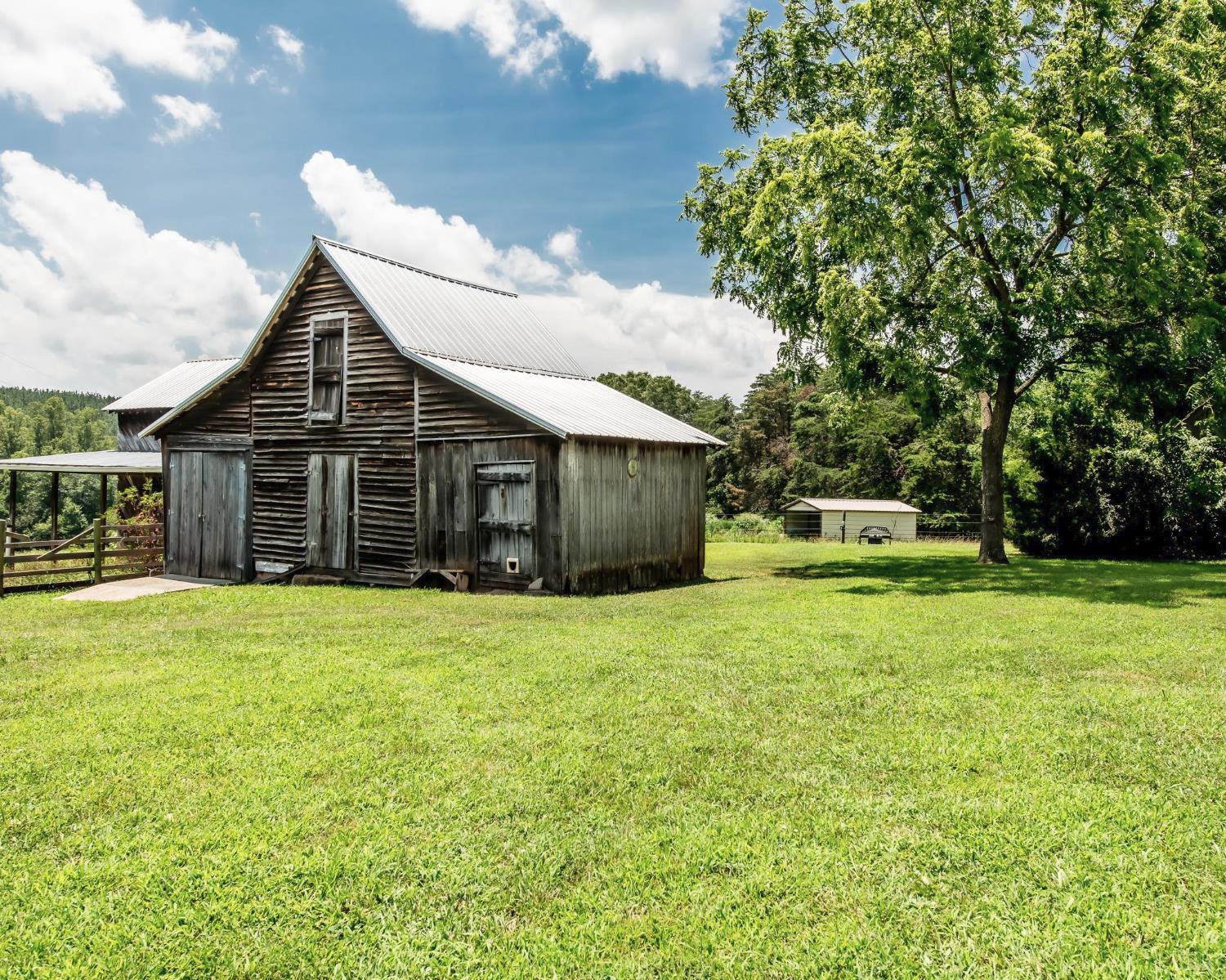 2667 Union Church Road Gladstone, VA 24553 - Photo 56 of 75 a front view of a house with a garden and trees