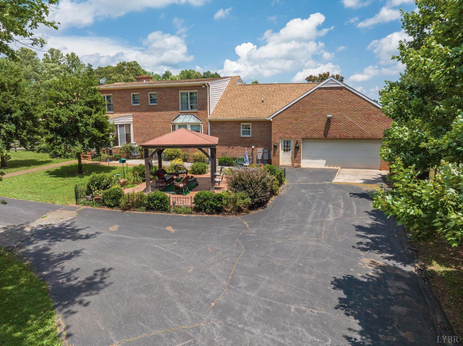 2667 Union Church Road Gladstone, VA 24553 - Photo 66 of 75 a front view of a house with a yard and garage