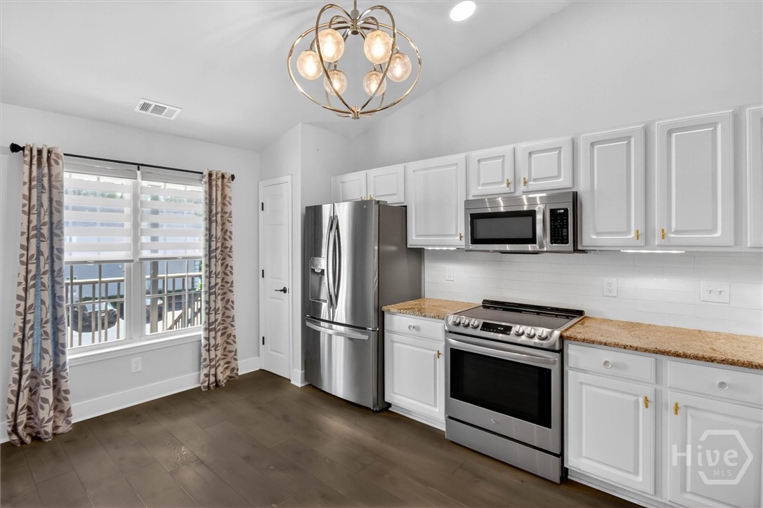16 River Walk, Unit 16 Savannah, GA 31410 - Photo 3 of 37 Light-filled, open kitchen with clean, modern updates