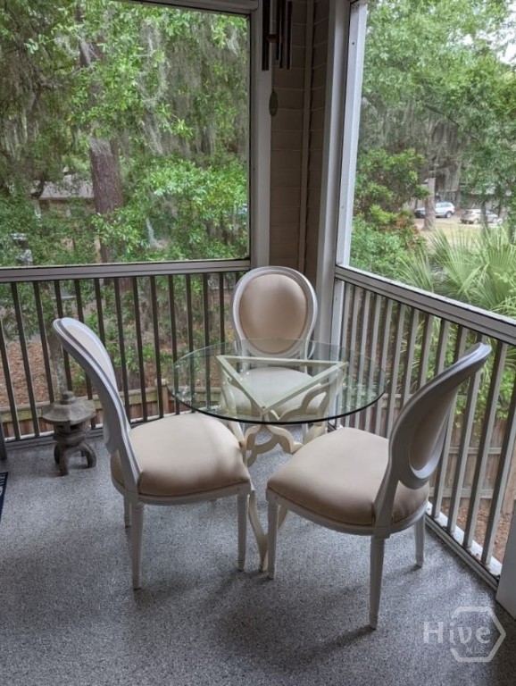 16 River Walk, Unit 16 Savannah, GA 31410 - Photo 33 of 37 Set among the trees, this screened porch offers a peaceful, private setting with natural light and a gentle sense of separation from the world below